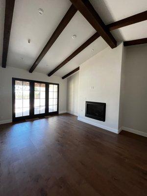 Beams stained, walls painted, baseboards.