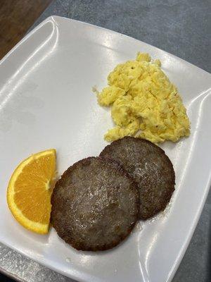 2 scrambled eggs with sausage patties