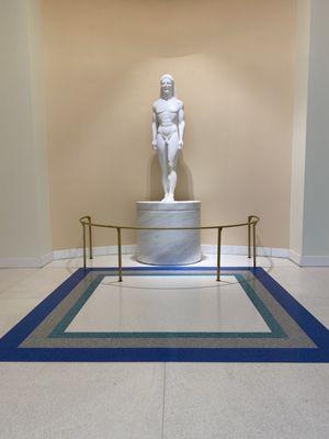 Kouros awaits in the lobby.