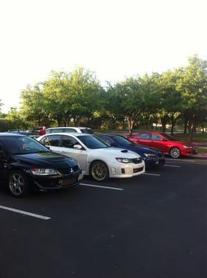 First Thursday. (Photobombing a row of shinier things with a dirty bone stock Lancer.)