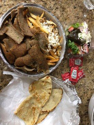 gyro platter that comes with truffle fries, greek salad, and pitta. A side of tzatziki was depressingly forgotten