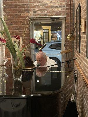 Owner on the piano singing