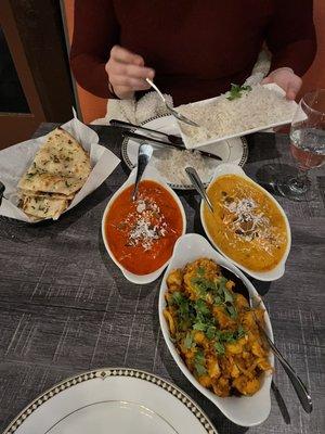 Butter chicken, shahi paneer, aloo gobi.