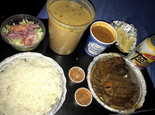 a tropical soda/caldo de pescado with a salad