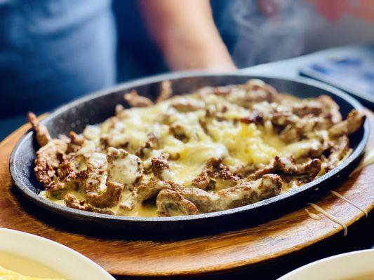 Hubby got the Cheese Steak frits Flambé  we fought over it! LOL AMAZBALLS get it! :)...