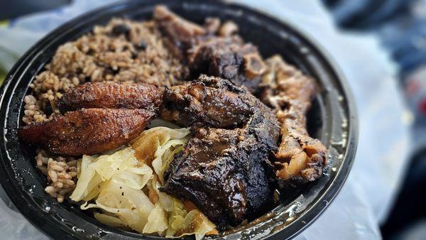 Oxtail and jerk chicken plate