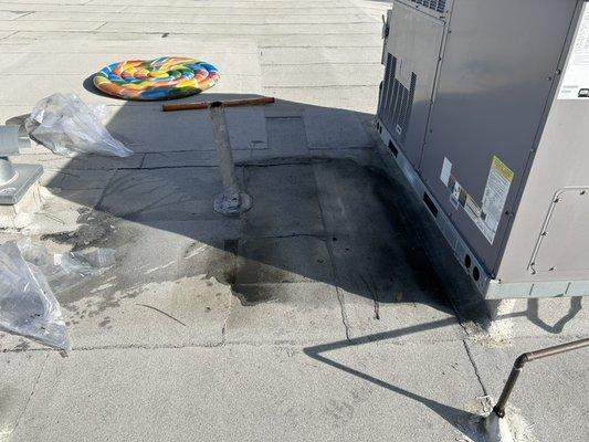 Left pic of leaking roof commercial building.