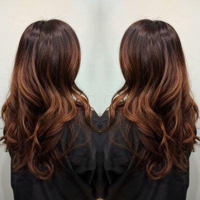 Rich dark chocolate and caramel tones balayaged throughout.