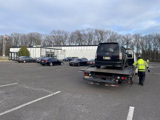 My car being towed after the Cherry Hill Inspection Station Blew up my transmission