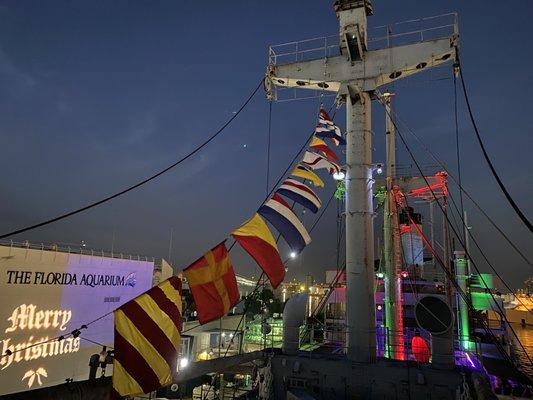 The ship is well decorated for the holiday boat parade viewing.