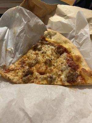 Slice of sausage pizza