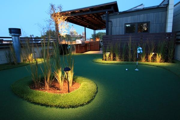 4 hole rooftop putting green with undulating curves, built in planters and LED Lighting -- fun & chic!