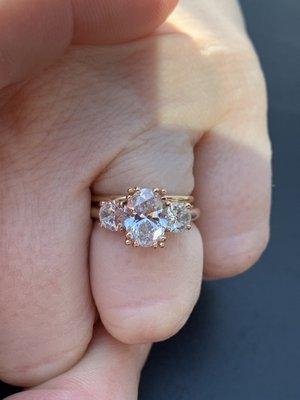 Custom made 18k rose gold engagement ring with oval diamonds