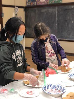 Making gingerbread houses in our afterschool program