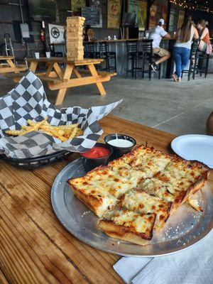 Out back. Cheese bread and fries.