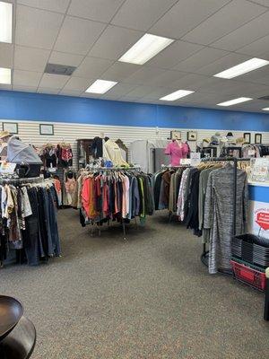 Some of the clothing racks in the front of the store