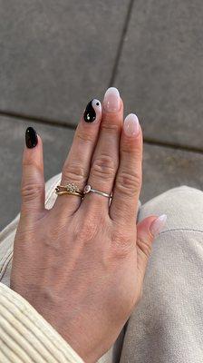 Acrylic gel manicure with ying-yang design on the ring finger