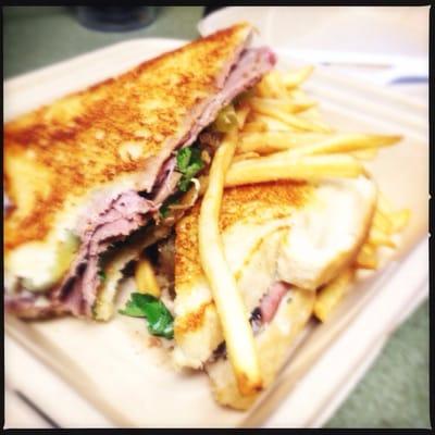 Grilled Roast Beef Sandwich with provolone, grilled onions, pickles, tomato, arugula, horseradish mayo on sourdough. Yum!