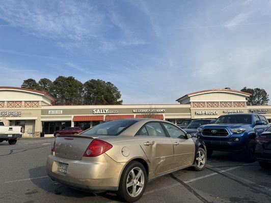 Idiot can't even park right at the NC plate place.