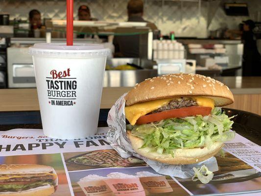 Charburger with cheese, lettuce and tomatoes  And a strawberry limeade drink