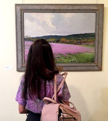 A patron gazes at one of SAAL+M's works from the Davis Collection.