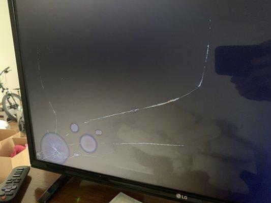 Broken computer monitor, and two broken television sets.