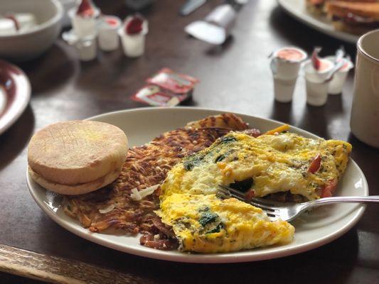 Bacon feta tomato spinach and cheddar omelette.