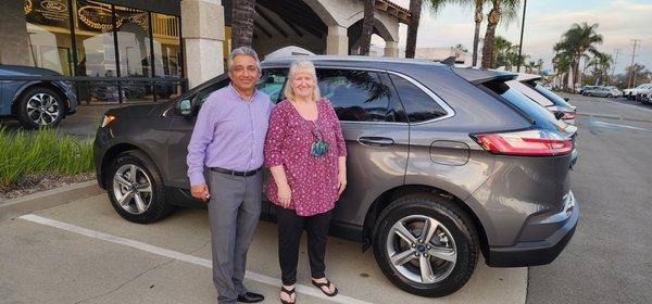 Rocky Lakhani and Dorothy Aberle in front of our new gray Edge, Advantage Ford