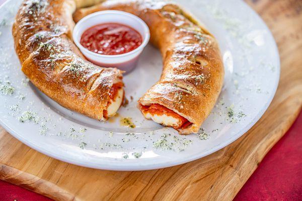 Add toppings inside to you favorite stromboli or calzone