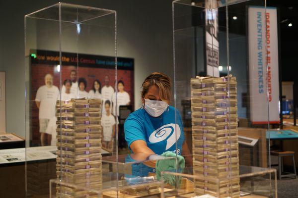 Science Museum Staff keeping things clean and sanitized for visitors.