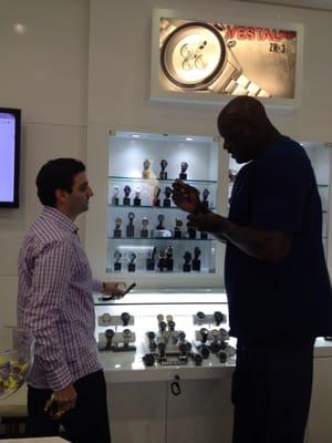 Trying to get a watch on Shaquille 's wrist!