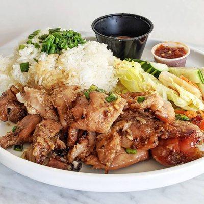 Grilled chicken over rice