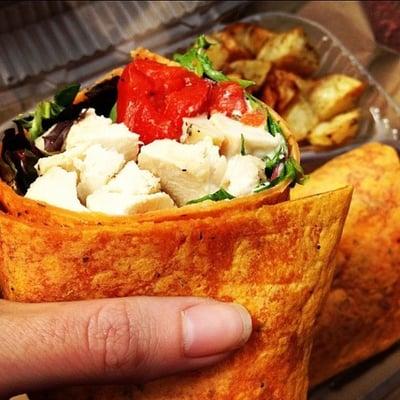 Manhattan Wrap: chicken, goat cheese, red pepper spring greens, basil, tomatoes