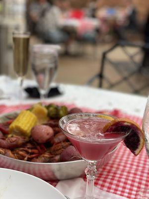 Blood orange cosmo and crawfish boil