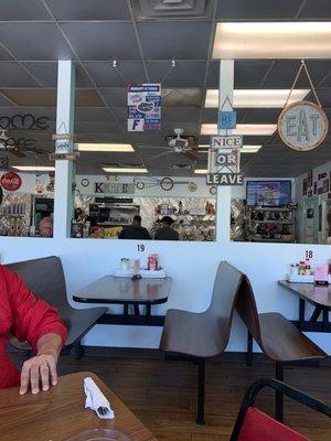 Love the big whisk hanging above the stools.