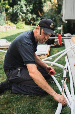 Jeremy, lead installer, putting together the lineset for this client's ductless unit.