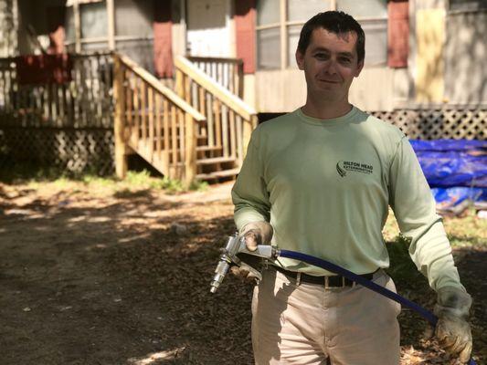 Hilton Head Exterminators technician, John Jolin, completing a pest control service for the Deep Well Project.