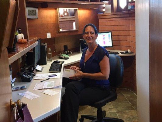 Lisa behind the scenes at the front desk running the show!  She greets everyone in such a cheerful and professional way!