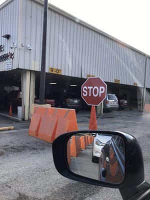 Waiting in line. Under the roof is 2 cars per lane. I'm next. 4 lanes