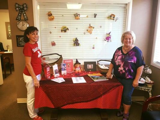 Shari & Claudette next to our Halloween office display!