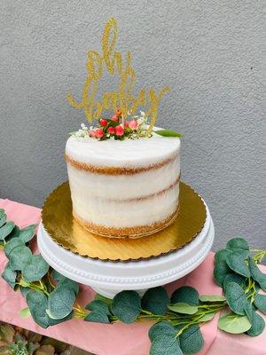 "Naked" style cake- fed 16 people, vanilla cake & cookies & cream mousse - I added topper etx. Under 60.00!