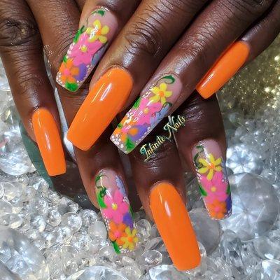 Long square nails with flower nail designs.