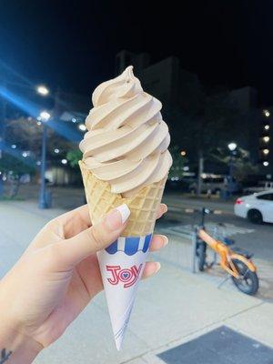 chocolate ice cream in a waffle cone