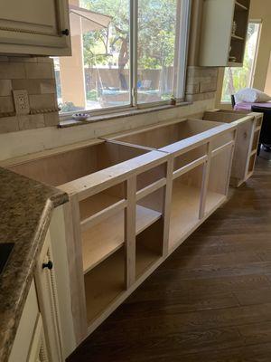 New cabinetry for new sink, drawers and dishwasher nook.