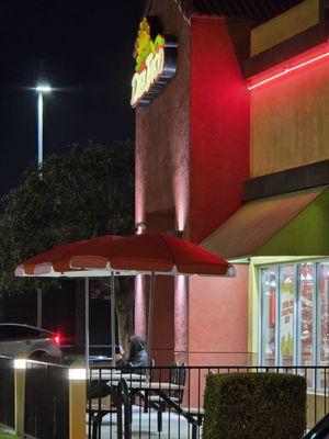 Homeless schizophrenia man sitting out side del taco making it unsafe for customers.