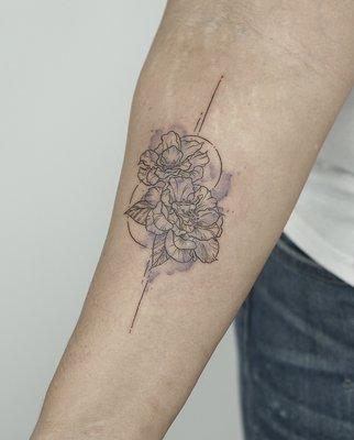 Floral watercolor tattoo done by Gu