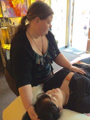 Doing a Reiki session.