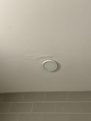 Picture of my water damaged ceiling that maintenance told me was due to my upstairs neighbor mopping their floors.