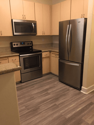 Stainless Appliances and Plank Flooring