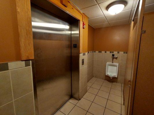 There's an elevator in the Men's bathroom. 5/5 stars would eat here again.